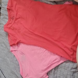 Two pink and coral round neck shirts